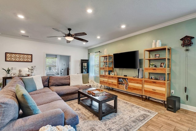 2707 162nd Ave E, Parrish, FL 34219 - living area with ornamental molding, wood finished floors, recessed lighting, ceiling fan, and baseboards