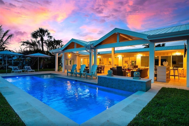 527 Key Royale Dr, Holmes Beach, FL 34217 - rear view of property with an outdoor pool, a patio, and outdoor dry bar