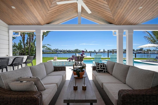 527 Key Royale Dr, Holmes Beach, FL 34217 - view of patio featuring a water view, an outdoor living space, ceiling fan, and an outdoor pool