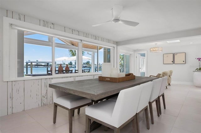 527 Key Royale Dr, Holmes Beach, FL 34217 - dining room featuring ceiling fan and light tile patterned floors
