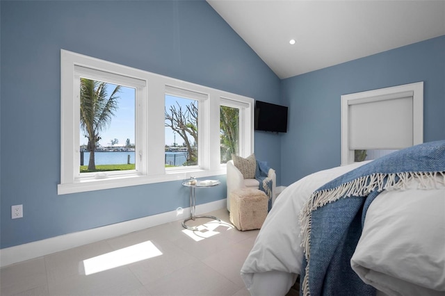 527 Key Royale Dr, Holmes Beach, FL 34217 - bedroom with high vaulted ceiling and baseboards