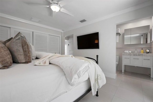 527 Key Royale Dr, Holmes Beach, FL 34217 - bedroom with visible vents, a closet, light tile patterned floors, ornamental molding, and ceiling fan