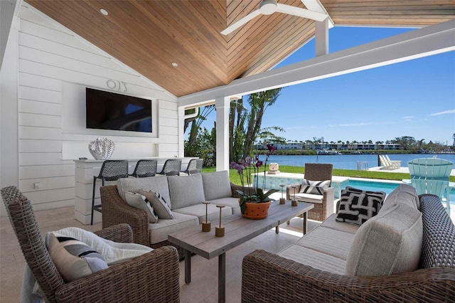 527 Key Royale Dr, Holmes Beach, FL 34217 - view of patio / terrace with a water view, ceiling fan, an outdoor hangout area, and an outdoor pool