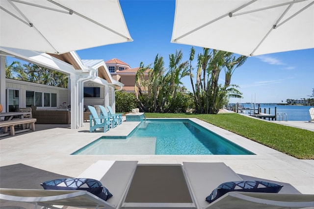 527 Key Royale Dr, Holmes Beach, FL 34217 - pool featuring a yard, an outdoor living space, a patio, and a water view