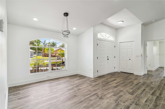 entrance foyer featuring recessed lighting, baseboards, and wood finished floors