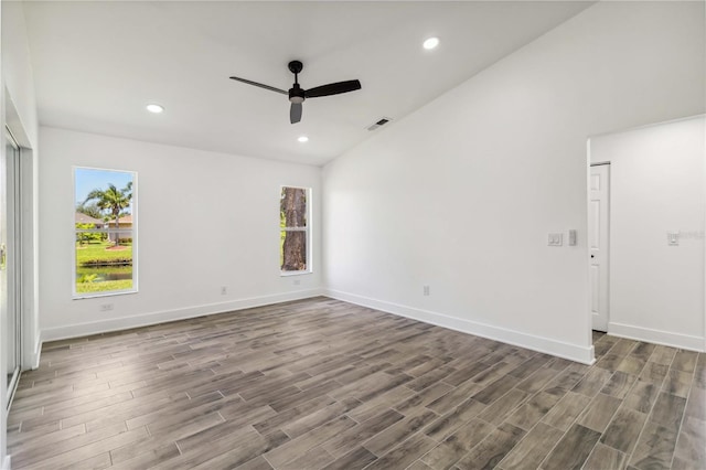 unfurnished room with baseboards, ceiling fan, and wood finished floors