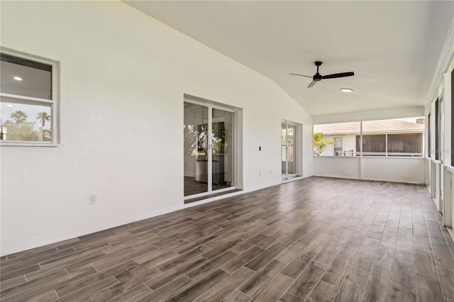 exterior space with recessed lighting, dark wood-style flooring, ceiling fan, and vaulted ceiling