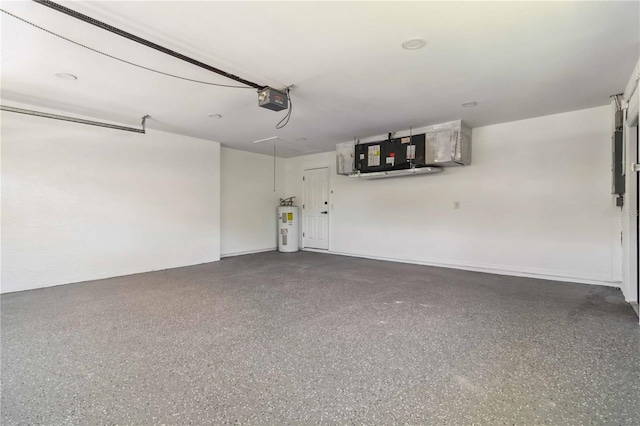 garage featuring a garage door opener and electric water heater
