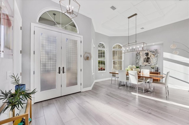 7257 Greystone St, Lakewood Ranch, FL 34202 - foyer with an inviting chandelier, french doors, baseboards, visible vents, and wood finished floors