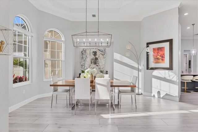 7257 Greystone St, Lakewood Ranch, FL 34202 - dining space featuring ornamental molding, baseboards, a notable chandelier, and wood finished floors