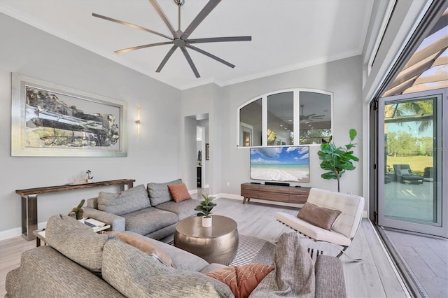 7257 Greystone St, Lakewood Ranch, FL 34202 - living room with light wood finished floors, baseboards, crown molding, and a ceiling fan