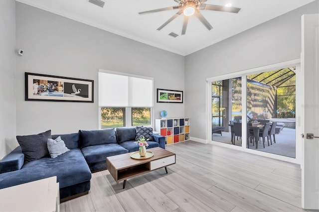 7257 Greystone St, Lakewood Ranch, FL 34202 - living room featuring baseboards, visible vents, wood finished floors, and ceiling fan