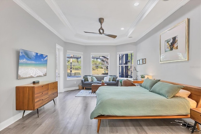7257 Greystone St, Lakewood Ranch, FL 34202 - bedroom with a tray ceiling, multiple windows, crown molding, and wood finished floors