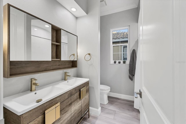 7257 Greystone St, Lakewood Ranch, FL 34202 - full bathroom with baseboards, toilet, double vanity, and a sink