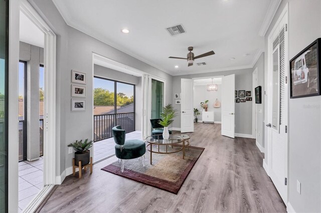 7257 Greystone St, Lakewood Ranch, FL 34202 - sitting room featuring ceiling fan, visible vents, crown molding, and wood finished floors