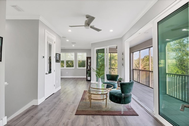 7257 Greystone St, Lakewood Ranch, FL 34202 - living area featuring crown molding, baseboards, ceiling fan, and visible vents