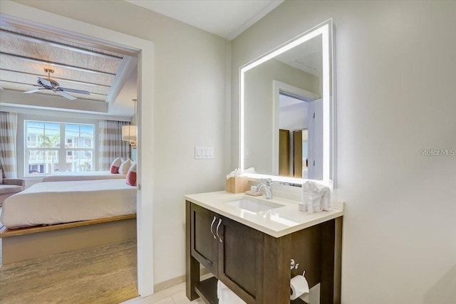 bathroom featuring vanity, ensuite bathroom, and ceiling fan