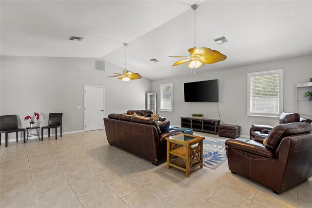 living room featuring vaulted ceiling, a ceiling fan, visible vents, and light tile patterned floors