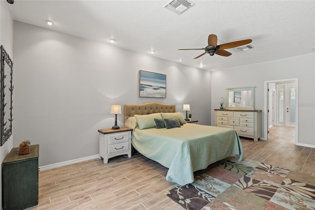 bedroom with recessed lighting, light wood-style flooring, visible vents, and baseboards