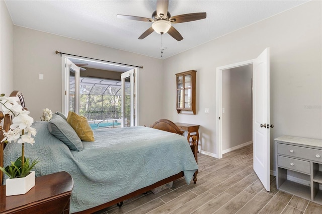 bedroom featuring light wood-style floors, access to exterior, baseboards, and ceiling fan