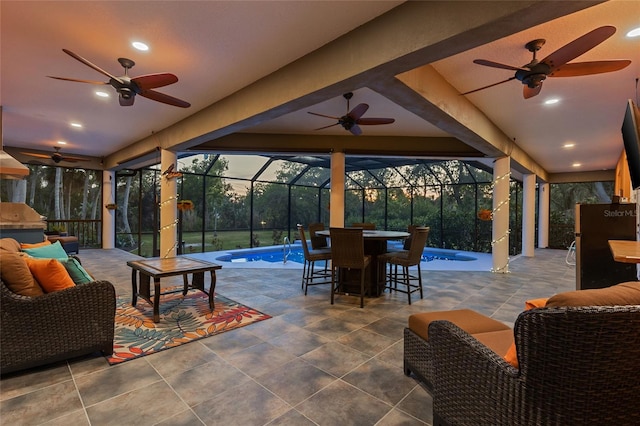view of patio / terrace with outdoor dining area, an outdoor pool, and ceiling fan