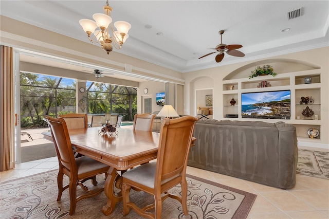 9818 Portside Ter, Bradenton, FL 34212 - dining room featuring light tile patterned flooring, ceiling fan with notable chandelier, and built in features