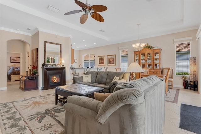 9818 Portside Ter, Bradenton, FL 34212 - living area with crown molding, baseboards, recessed lighting, ceiling fan with notable chandelier, and light tile patterned floors