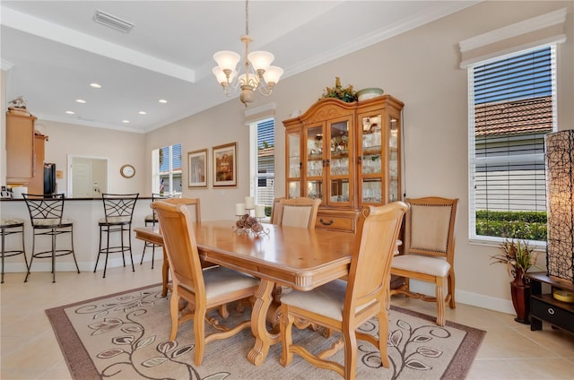 9818 Portside Ter, Bradenton, FL 34212 - dining room with light tile patterned floors, ornamental molding, a chandelier, and visible vents