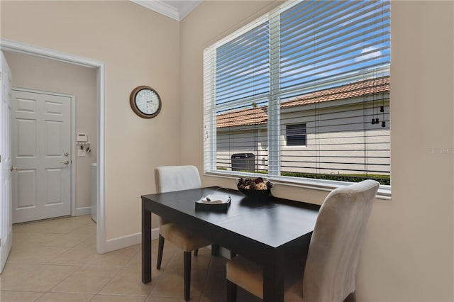9818 Portside Ter, Bradenton, FL 34212 - dining room featuring light tile patterned floors, baseboards, and crown molding
