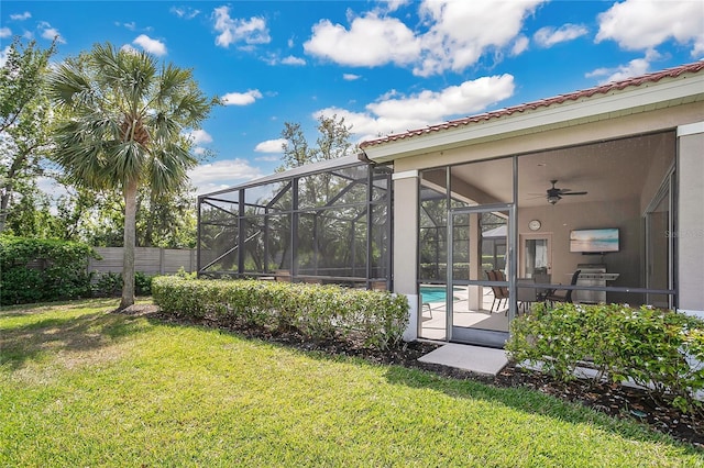 9818 Portside Ter, Bradenton, FL 34212 - view of yard featuring glass enclosure and fence
