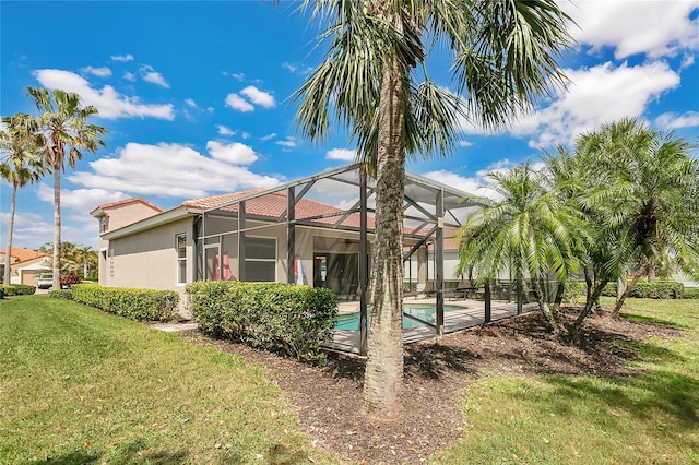 9818 Portside Ter, Bradenton, FL 34212 - exterior space featuring stucco siding, a lanai, a yard, and an outdoor pool