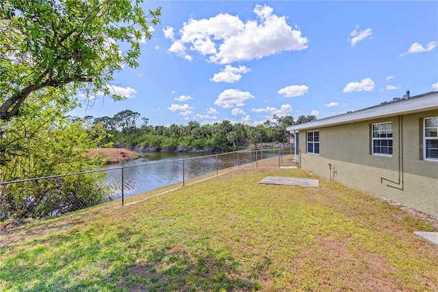 1665 Harmony Dr, Port Charlotte, FL 33952 - view of yard with a water view and a fenced backyard