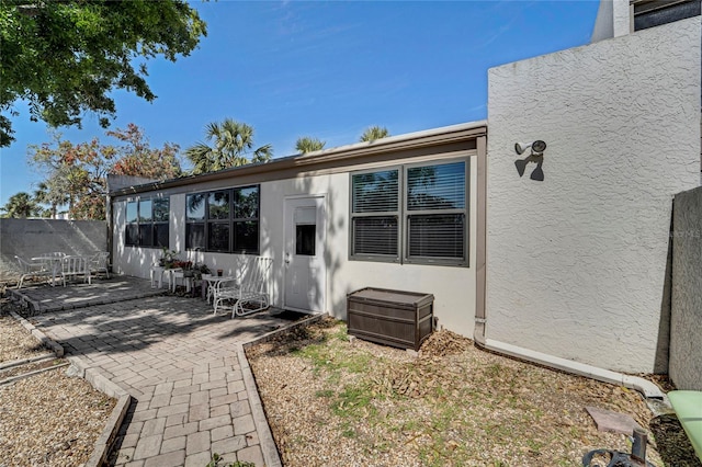501 Lakeside Dr Unit 501, Bradenton, FL 34210 - exterior space featuring stucco siding, fence, and a patio area