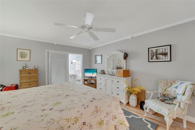 501 Lakeside Dr Unit 501, Bradenton, FL 34210 - bedroom featuring a textured ceiling, ornamental molding, and wood finished floors