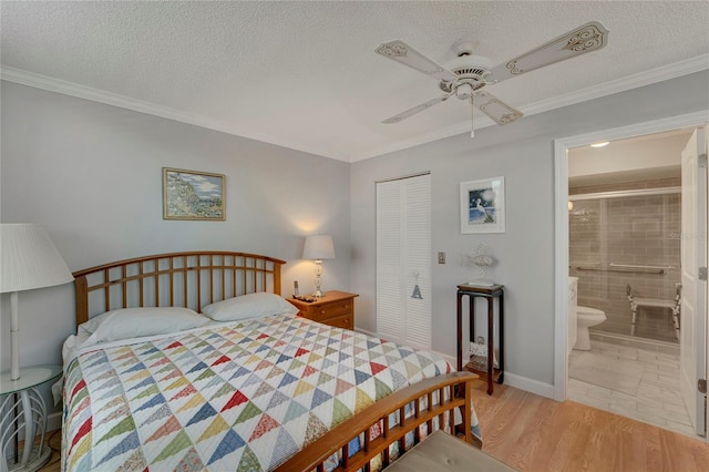 501 Lakeside Dr Unit 501, Bradenton, FL 34210 - bedroom featuring light wood-style flooring, ornamental molding, a closet, and a textured ceiling