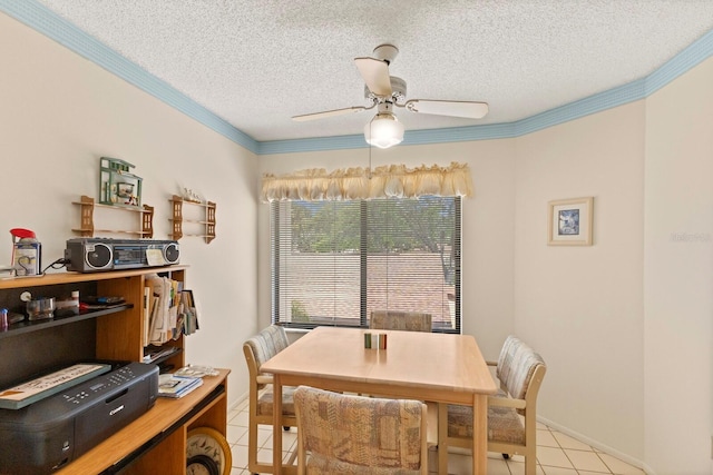 dining area featuring crown molding, a ceiling fan, a textured ceiling, and light tile patterned floors
