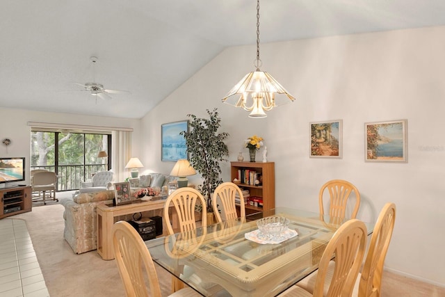 carpeted dining room featuring vaulted ceiling and ceiling fan with notable chandelier
