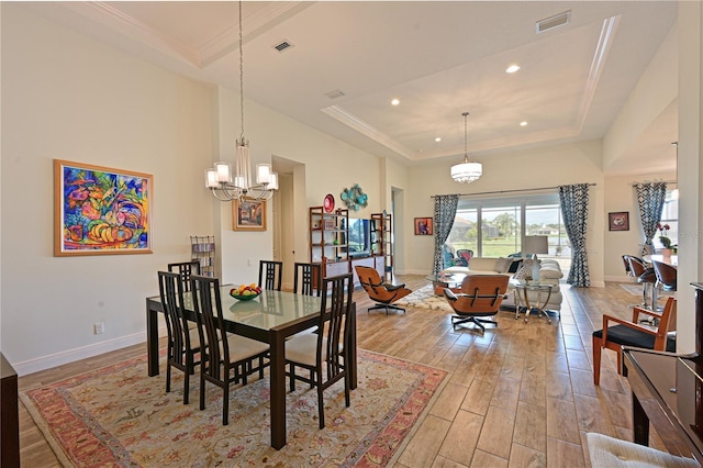1017 Siberian Gln, Bradenton, FL 34212 - dining space with baseboards, a raised ceiling, light wood-style floors, and plenty of natural light