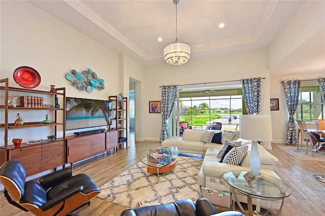 1017 Siberian Gln, Bradenton, FL 34212 - living area featuring a chandelier, a tray ceiling, baseboards, recessed lighting, and wood finished floors