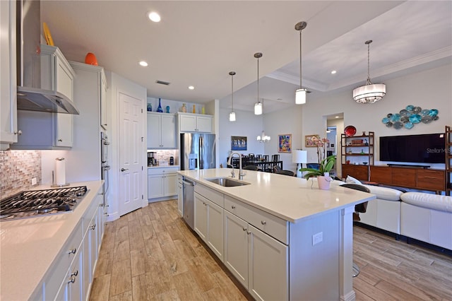 1017 Siberian Gln, Bradenton, FL 34212 - kitchen featuring stainless steel appliances, decorative backsplash, light wood finished floors, and a sink