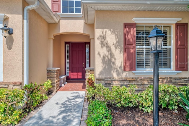 6310 Golden Eye Gln, Lakewood Ranch, FL 34202 - view of exterior entry with stucco siding and stone siding