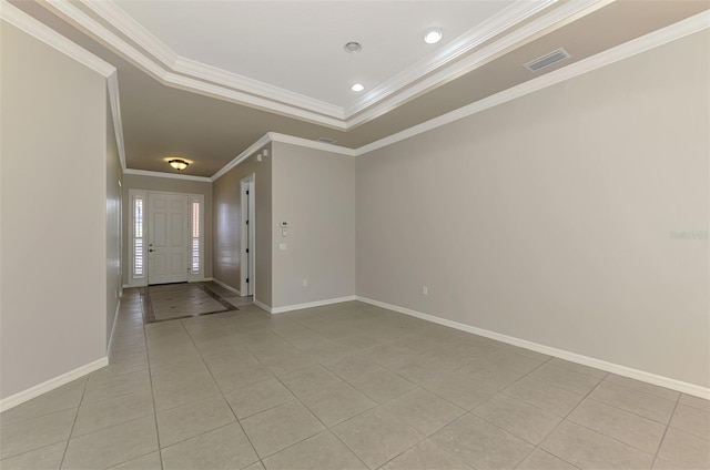 6310 Golden Eye Gln, Lakewood Ranch, FL 34202 - unfurnished room featuring light tile patterned floors, ornamental molding, baseboards, and a tray ceiling