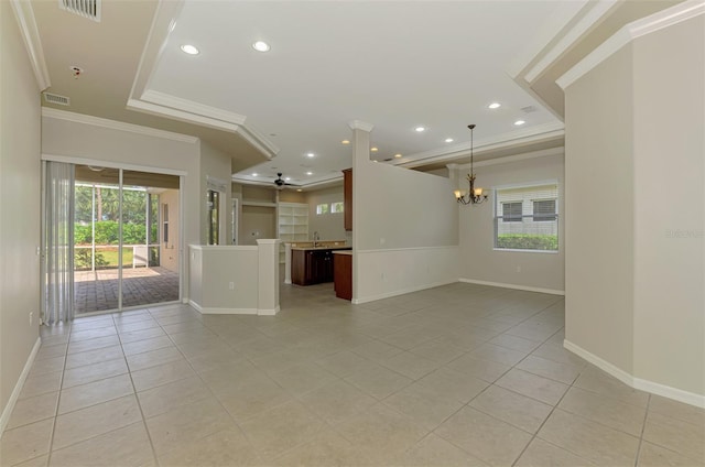 6310 Golden Eye Gln, Lakewood Ranch, FL 34202 - unfurnished living room with a chandelier, light tile patterned floors, crown molding, baseboards, and recessed lighting