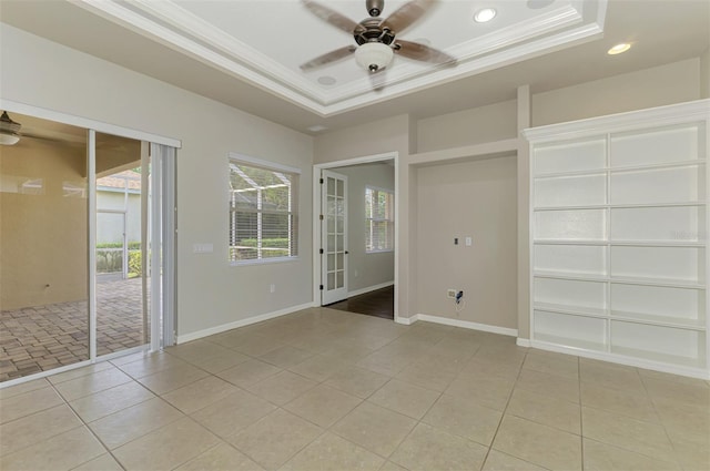 6310 Golden Eye Gln, Lakewood Ranch, FL 34202 - unfurnished room featuring a ceiling fan, crown molding, a raised ceiling, light tile patterned floors, and recessed lighting