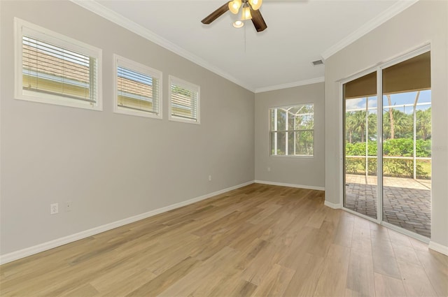 6310 Golden Eye Gln, Lakewood Ranch, FL 34202 - unfurnished room with light wood finished floors, plenty of natural light, a ceiling fan, crown molding, and baseboards