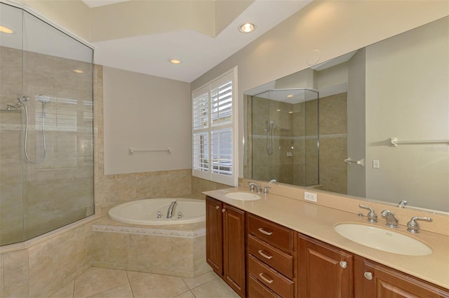 6310 Golden Eye Gln, Lakewood Ranch, FL 34202 - full bath featuring a tile shower, a bath, tile patterned flooring, double vanity, and recessed lighting