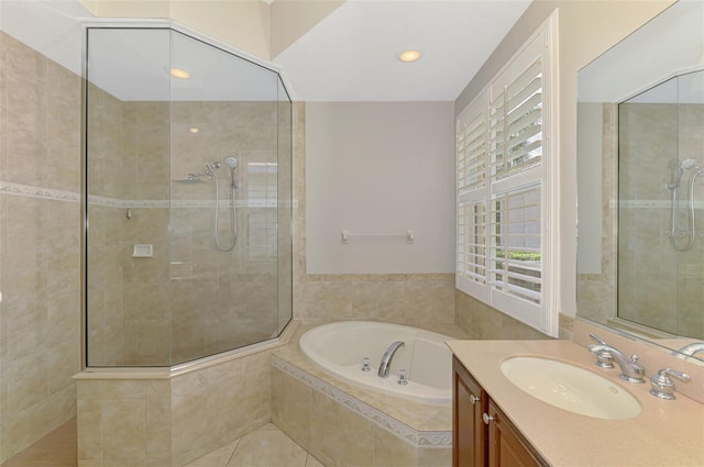 6310 Golden Eye Gln, Lakewood Ranch, FL 34202 - bathroom featuring tiled shower, a garden tub, vanity, recessed lighting, and tile patterned floors