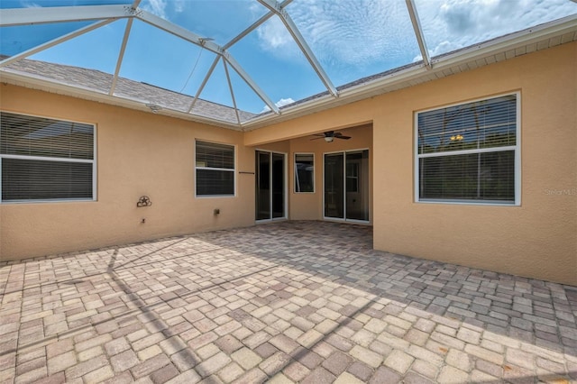 6310 Golden Eye Gln, Lakewood Ranch, FL 34202 - back of house featuring a ceiling fan, a patio, stucco siding, and a lanai