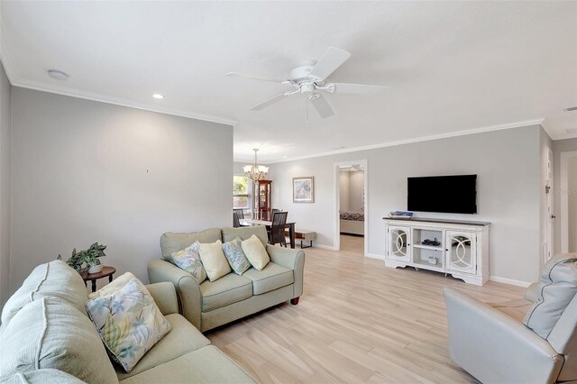 4420 Tecumseh Trl Unit 38, Sarasota, FL 34233 - living area with baseboards, a chandelier, crown molding, a ceiling fan, and recessed lighting
