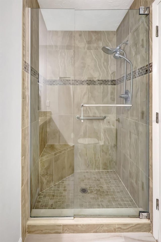 4420 Tecumseh Trl Unit 38, Sarasota, FL 34233 - bathroom featuring a shower stall